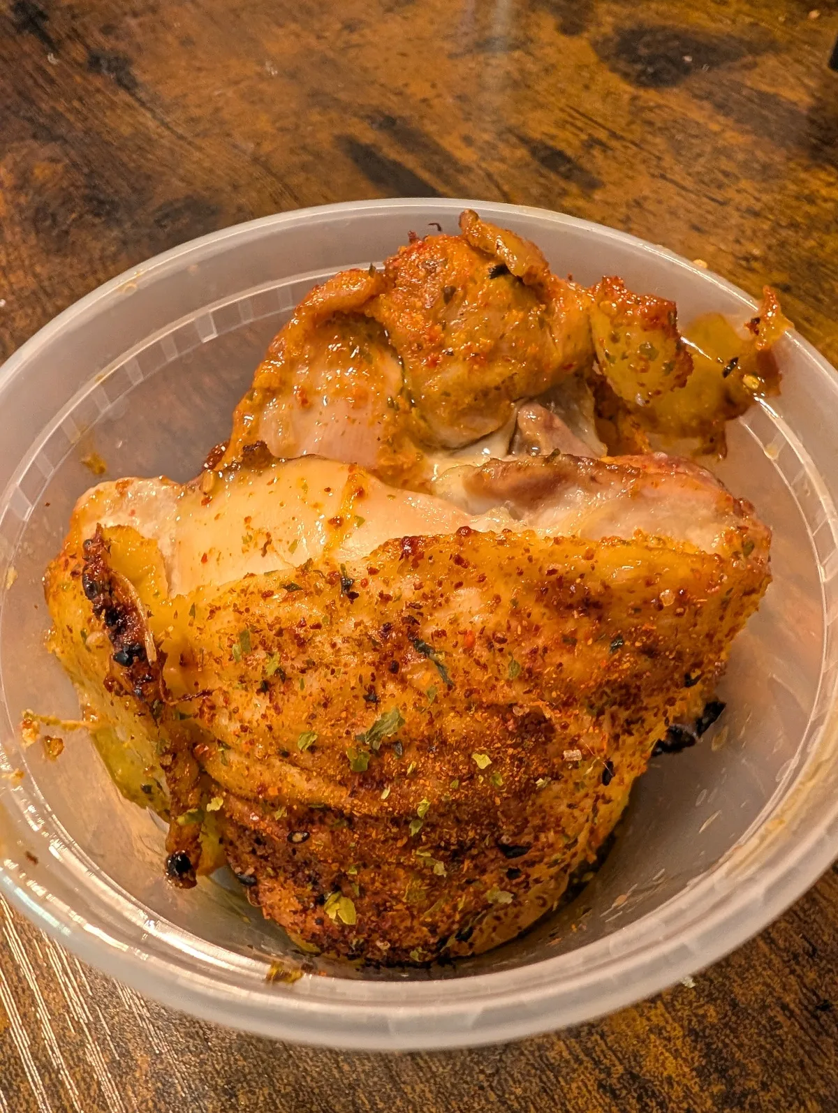 Batch-cooked chicken thighs stored in deli containers